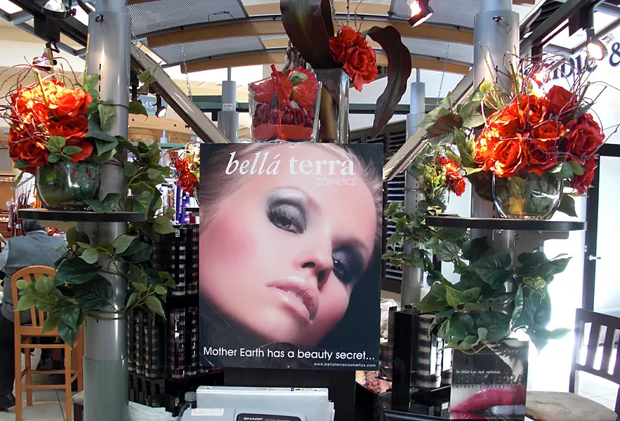 BELLATERRA poster reading Mother Earth has a beauty secret on a kiosk decorated with red roses, 2008
